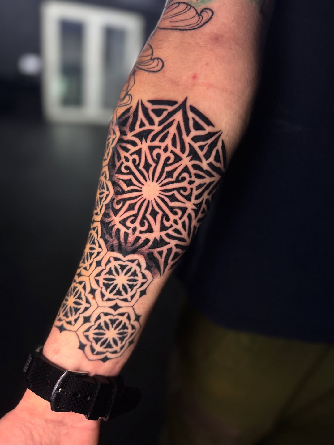 Ornamental Mandala Forearm Tattoo with Bold Blackwork