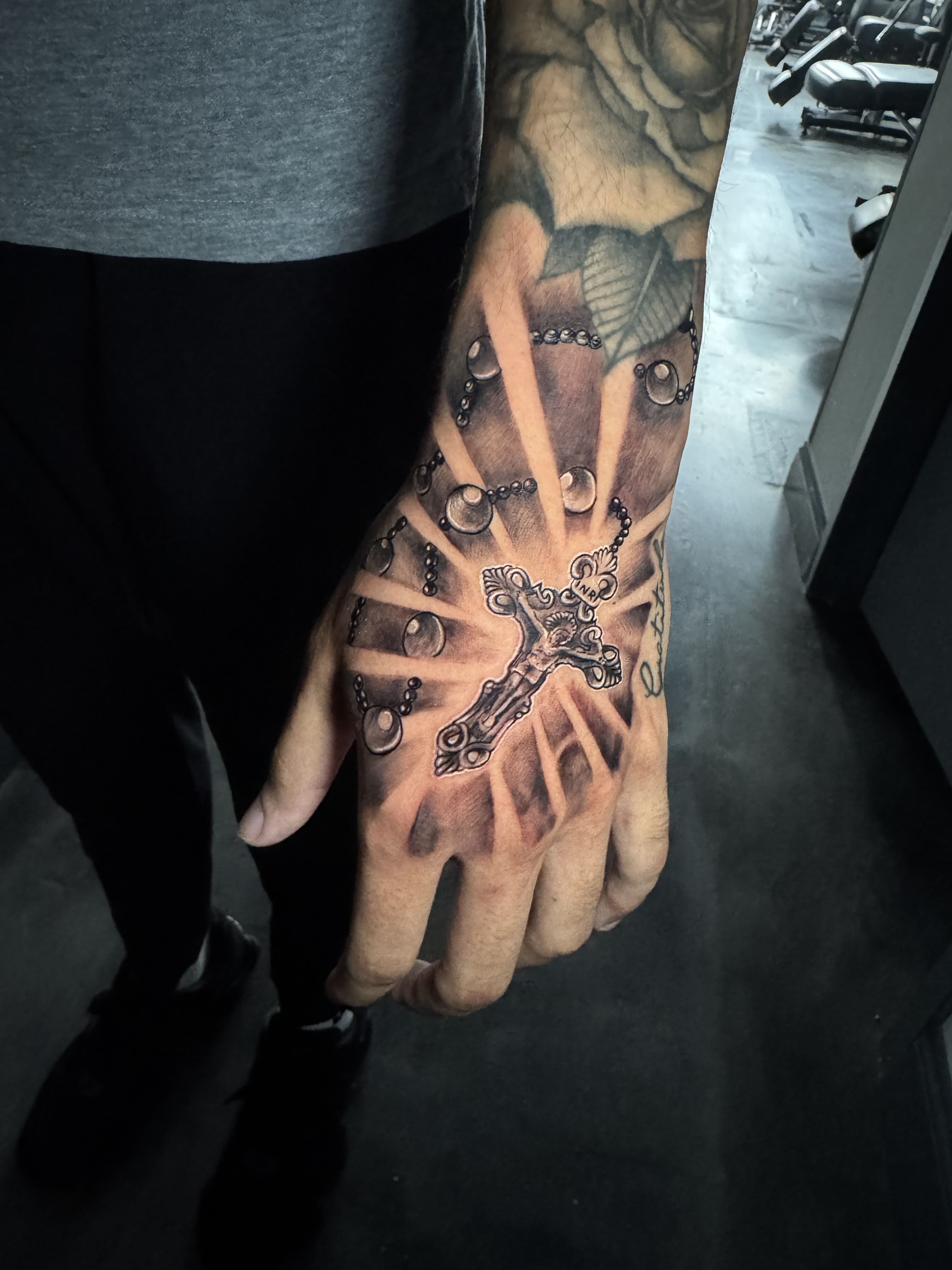Radiant Rosary Cross Hand Tattoo