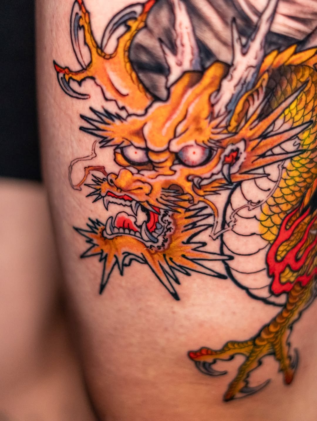 Praying Madonna & Eastern Dragon Thigh Tattoo