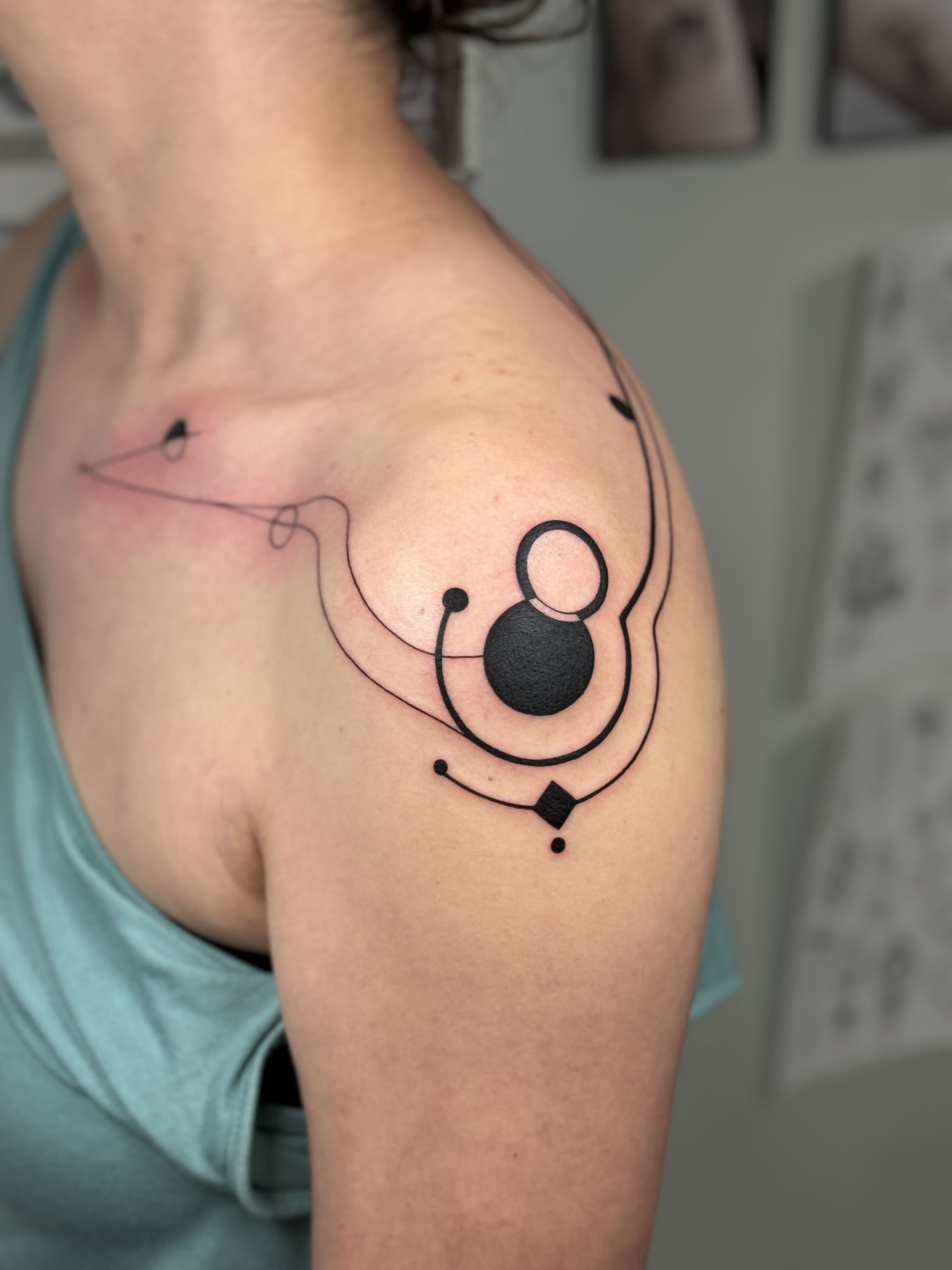 Geometric Orbit Shoulder Tattoo