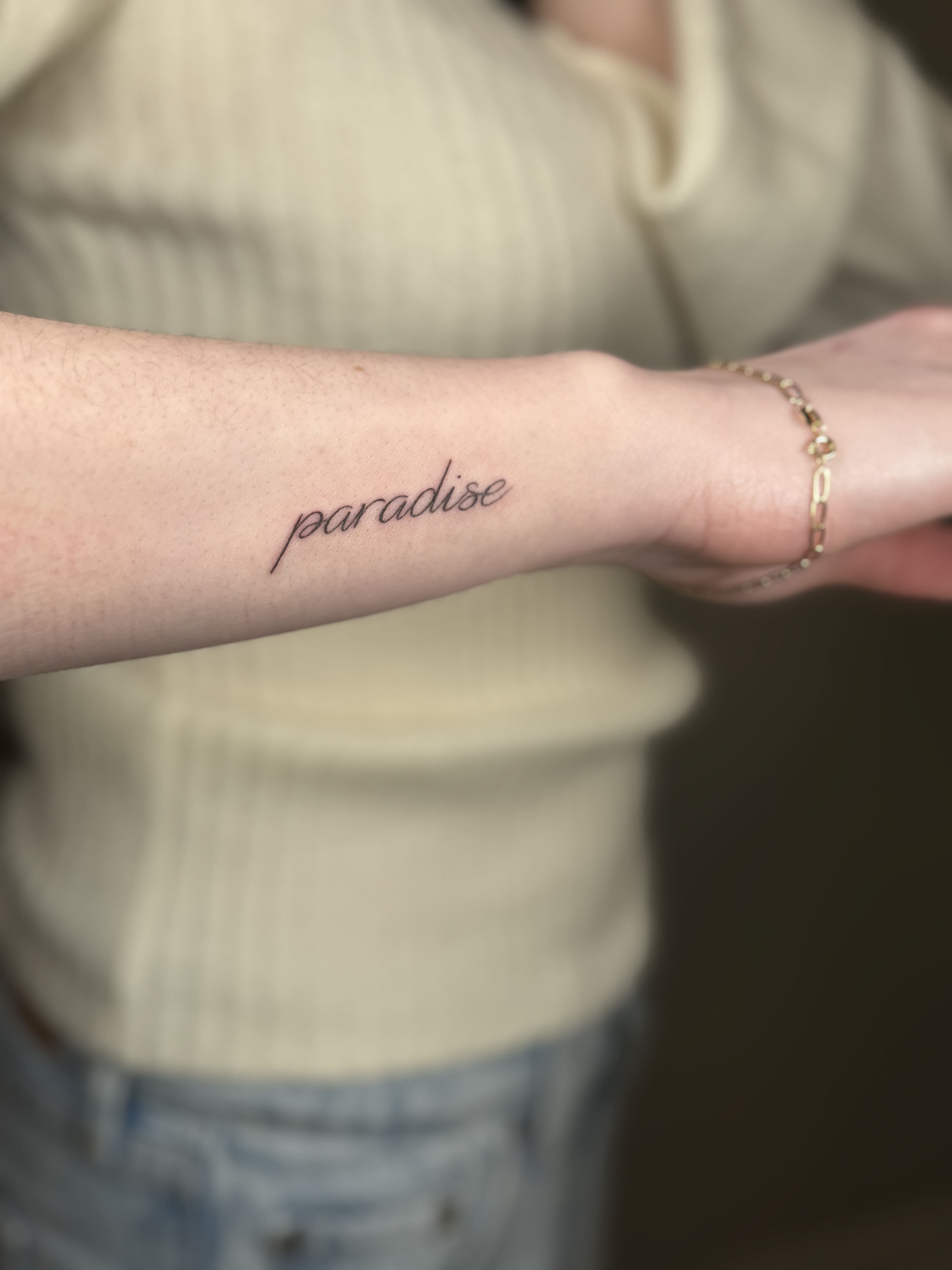 Minimal Script Word Tattoo — “Paradise”