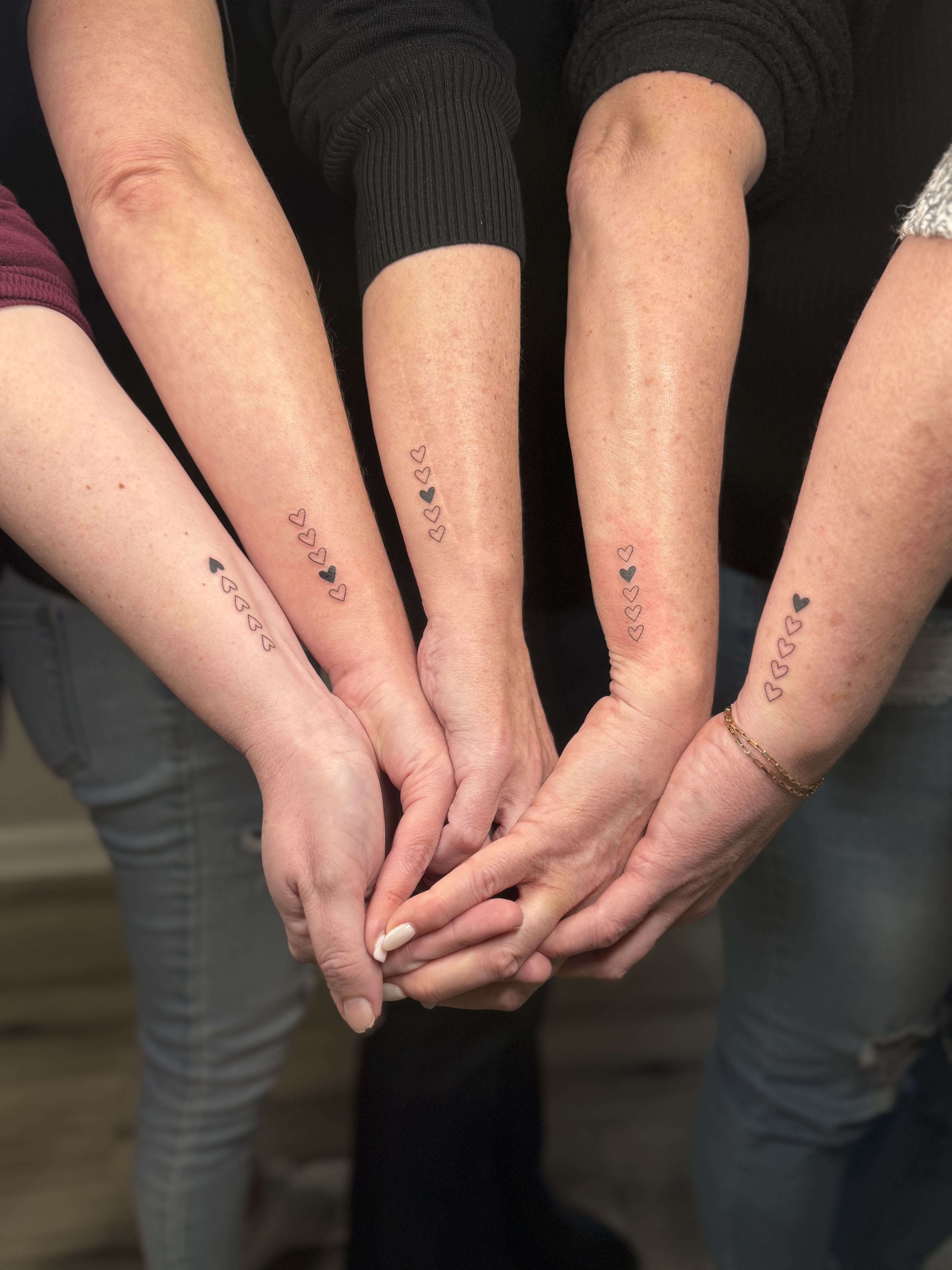 Matching Fine Line Heart Tattoos