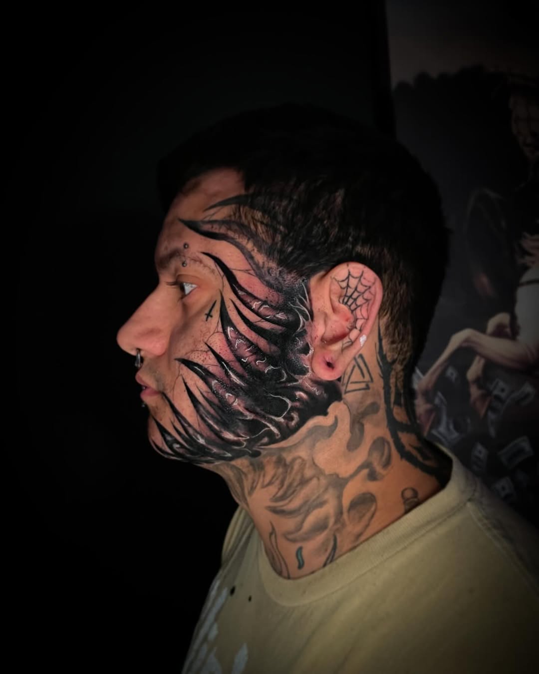 Dark Venom-Inspired Face Tattoo