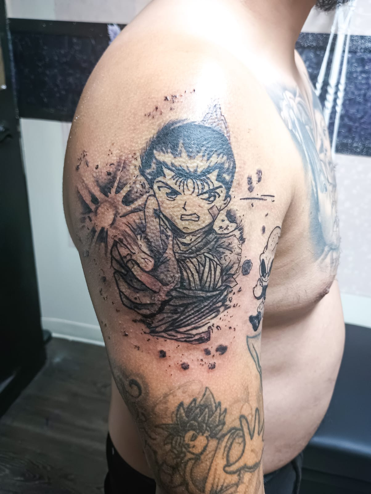 Anime Ink Splash Shoulder Tattoo