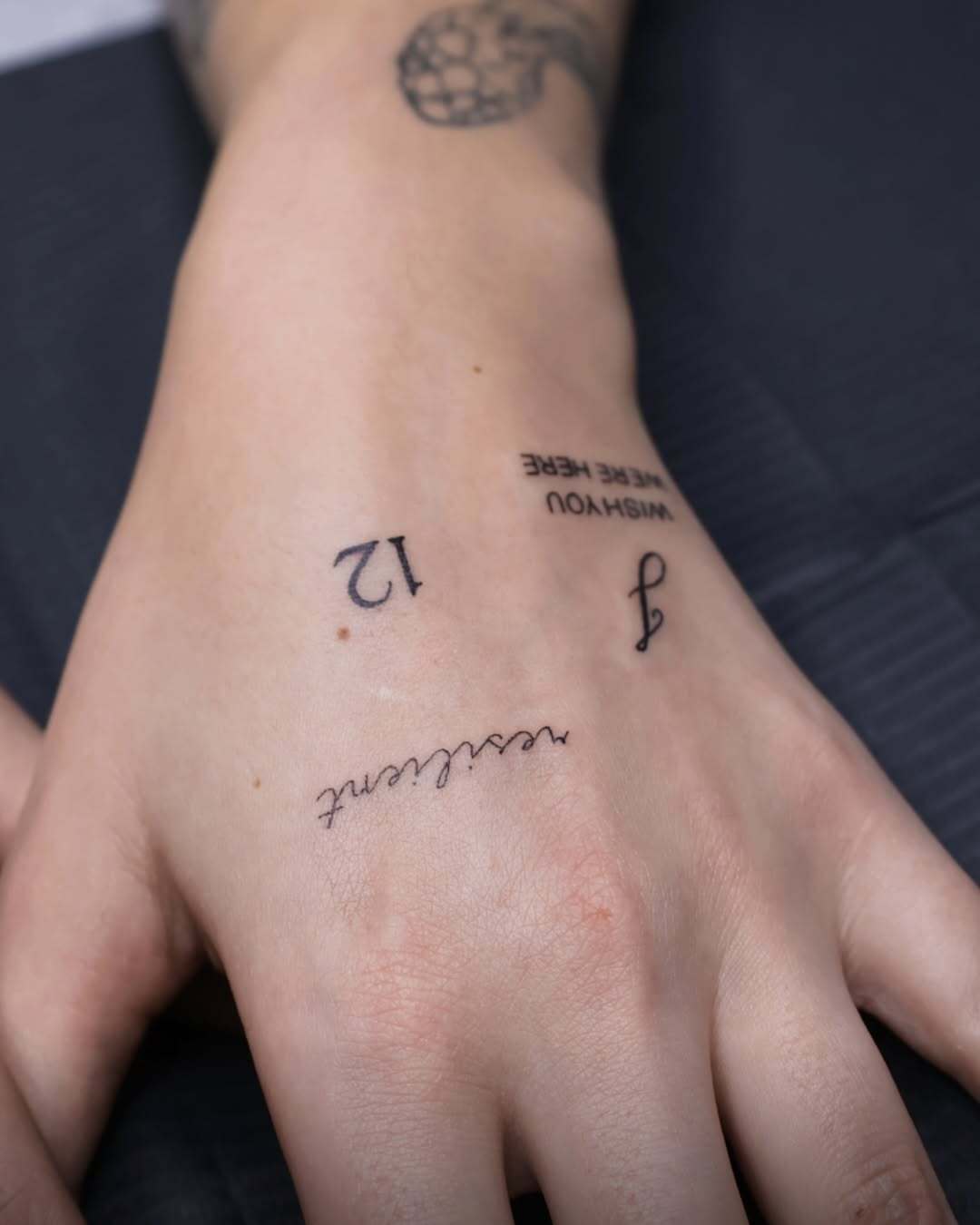 Minimal Script & Initial Hand Tattoos