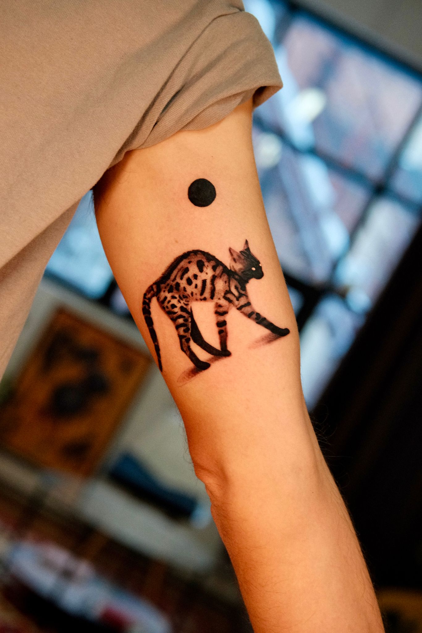 Minimalist Spotted Cat Tattoo