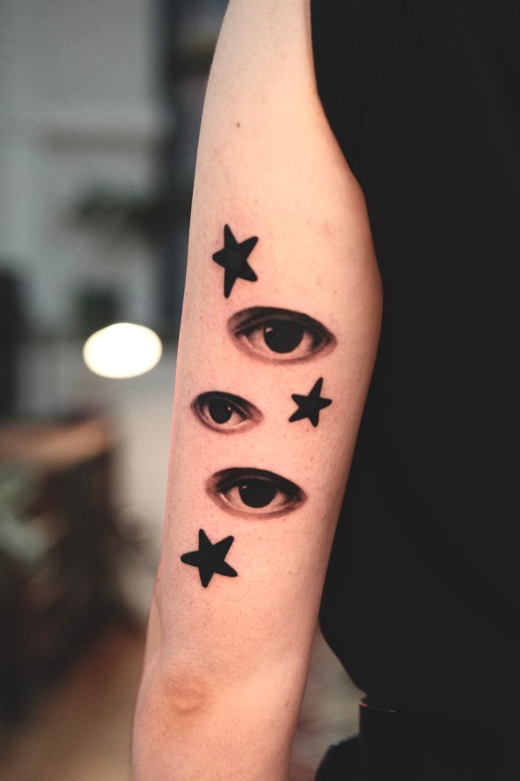 Three Eyes Minimalist Tattoo with Stars