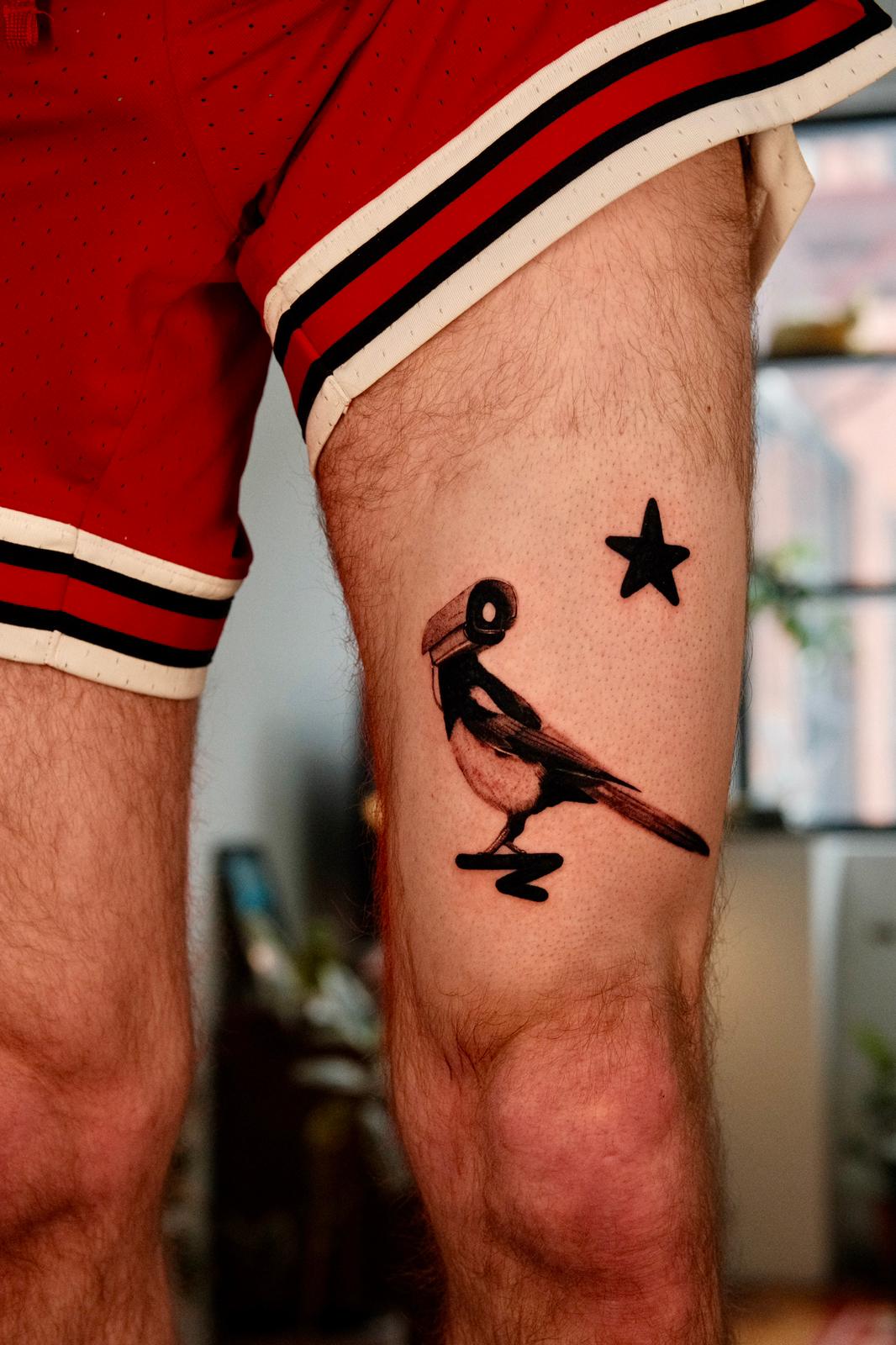 Minimalist Bird Tattoo with Abstract Head Detail