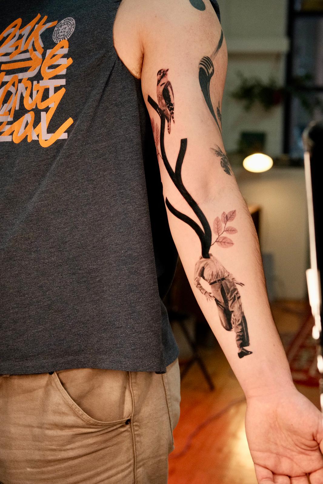 Surreal Growth Tattoo with Bird and Human Figure