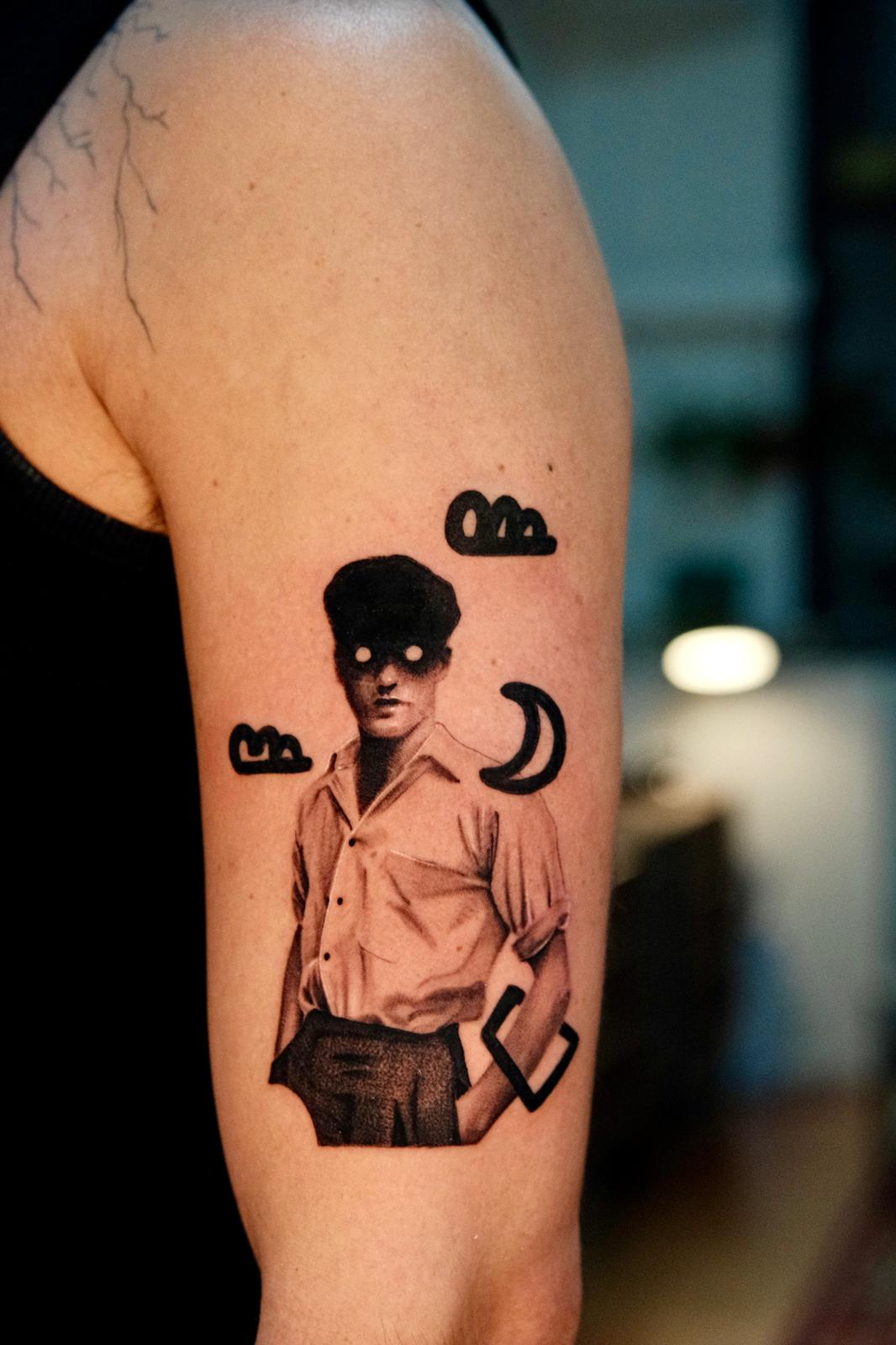 Surreal Figure Tattoo with Graphic Symbols