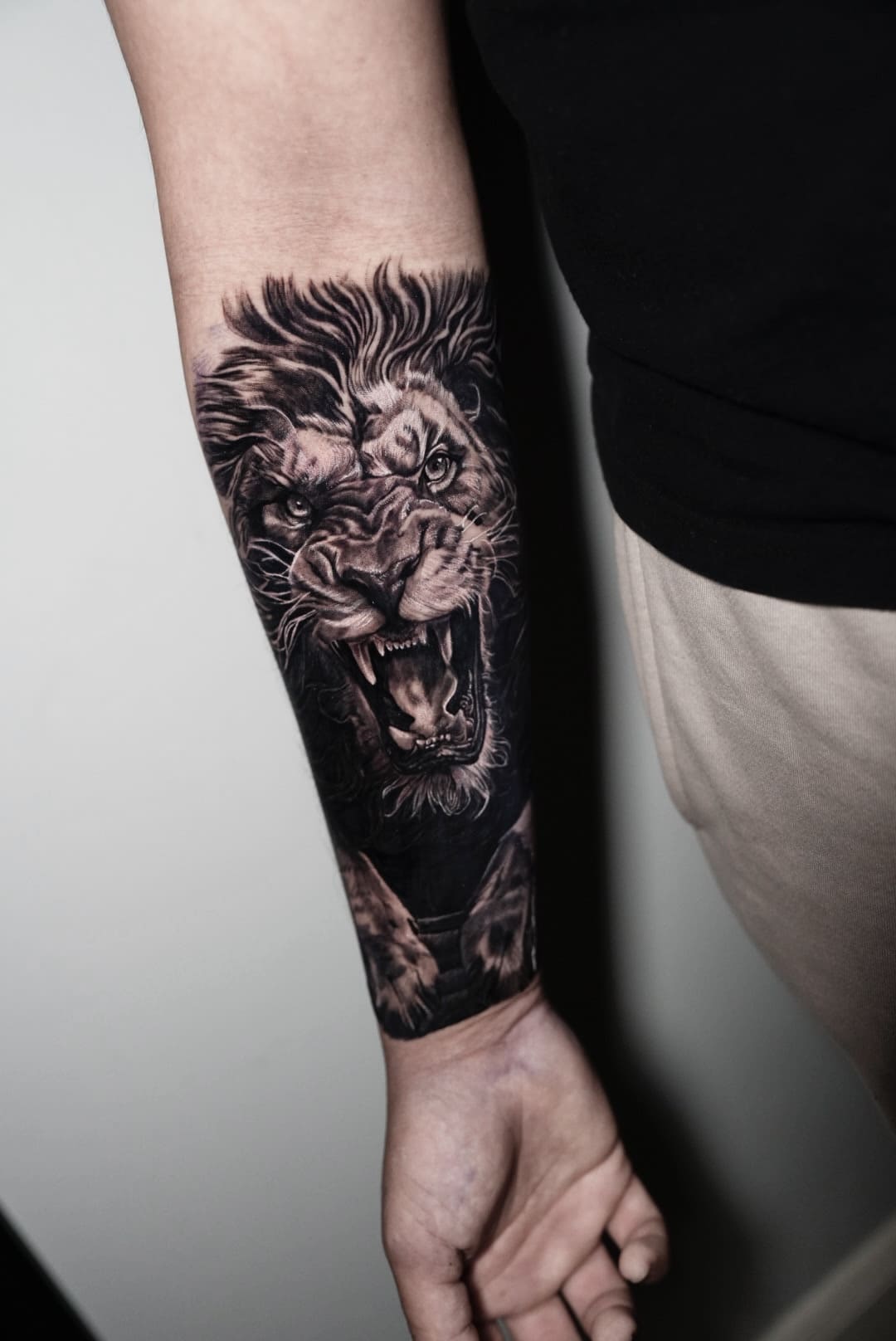 Roaring Lion Black & Grey Realism Forearm Tattoo