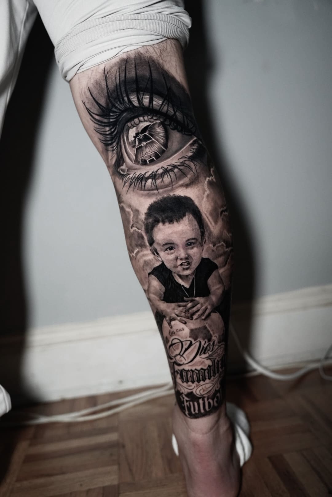 Eye & Child Portrait Black & Grey Realism Leg Tattoo