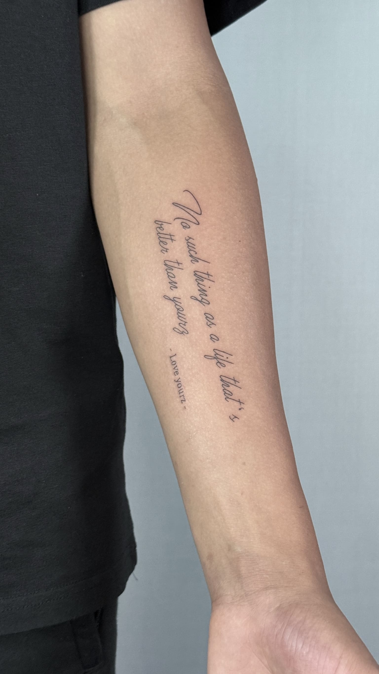 Fine Line Vertical Script Quote Tattoo