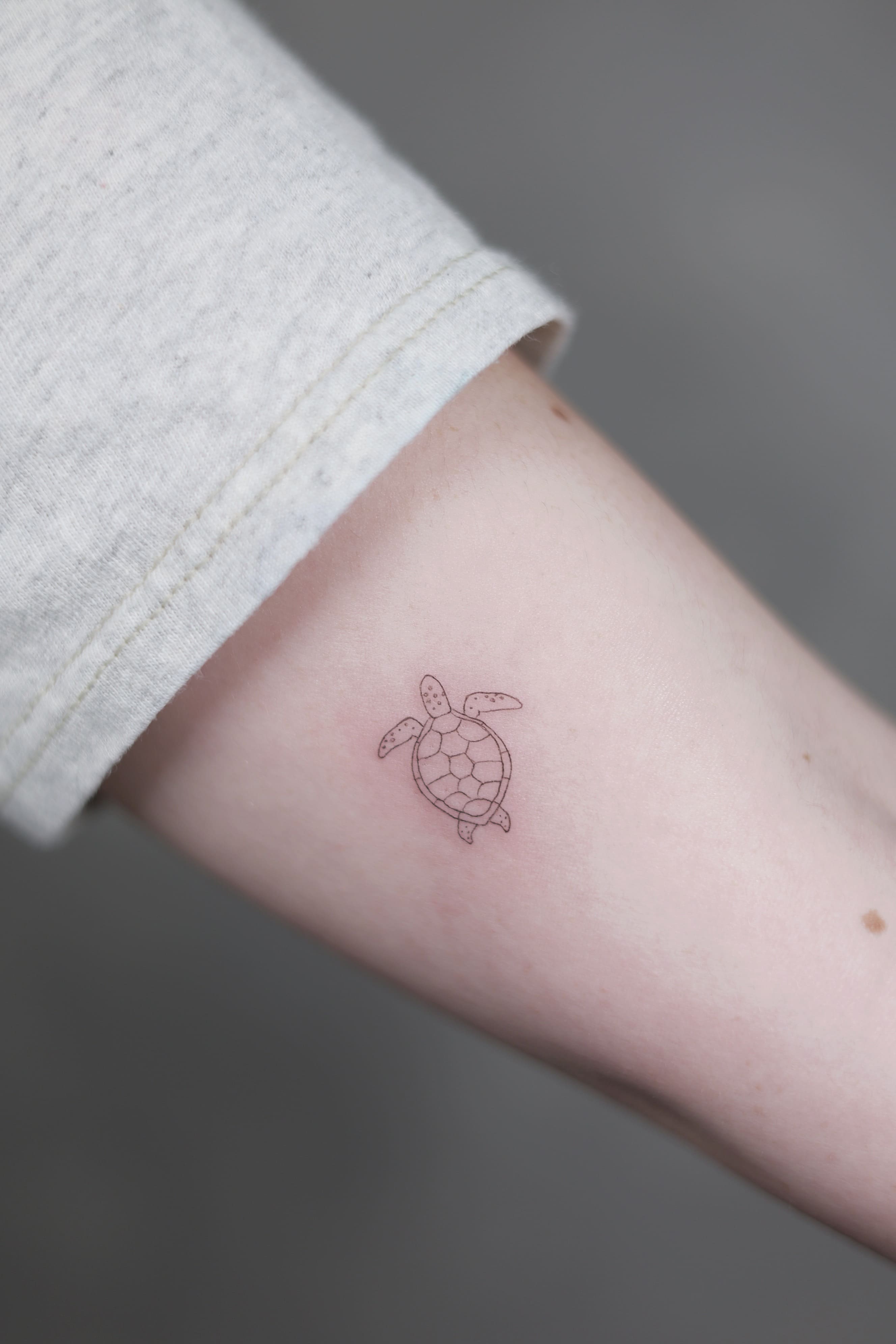 Minimal Sea Turtle Fine Line Tattoo
