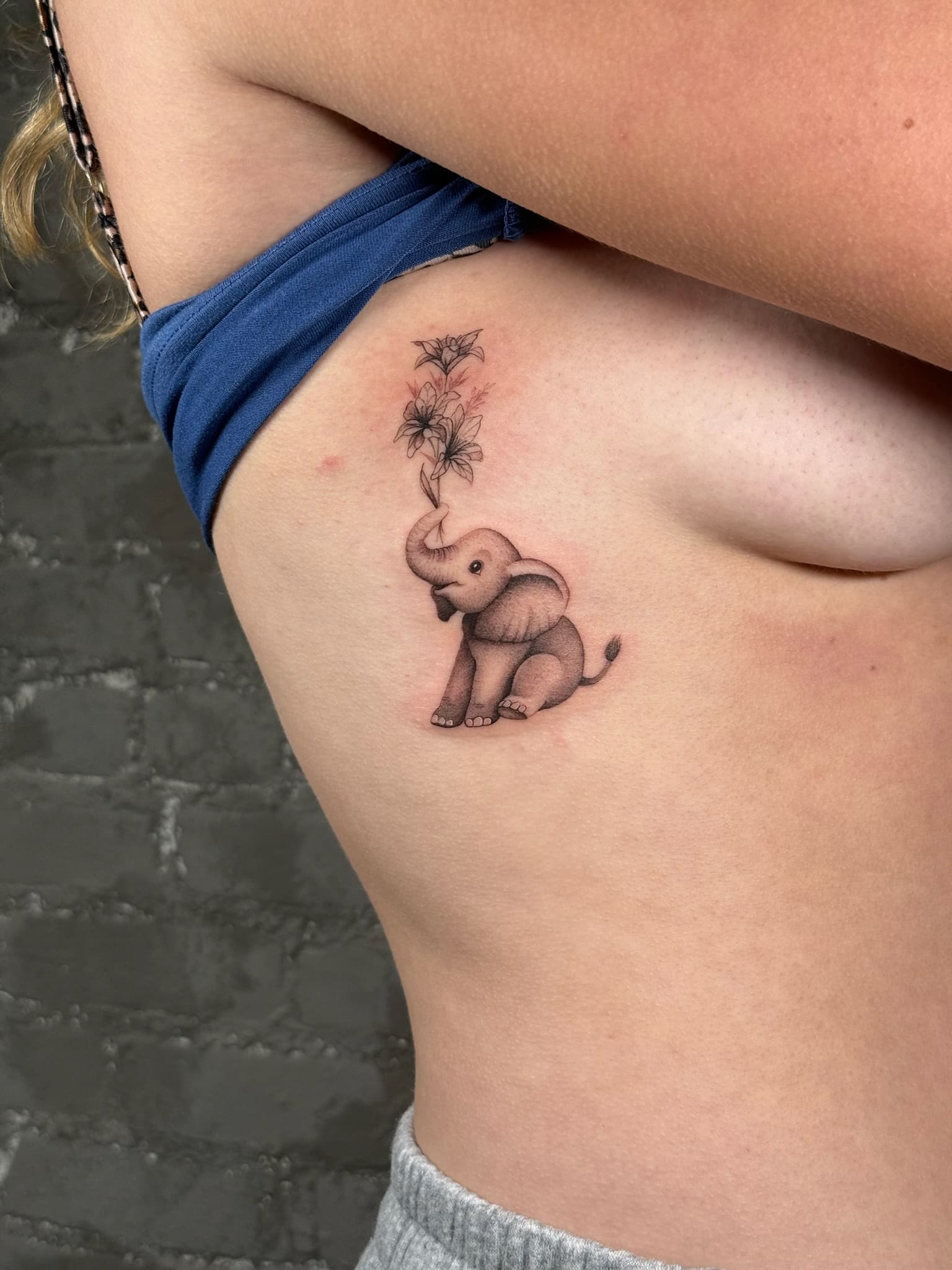 Playful Elephant & Floral Tattoo