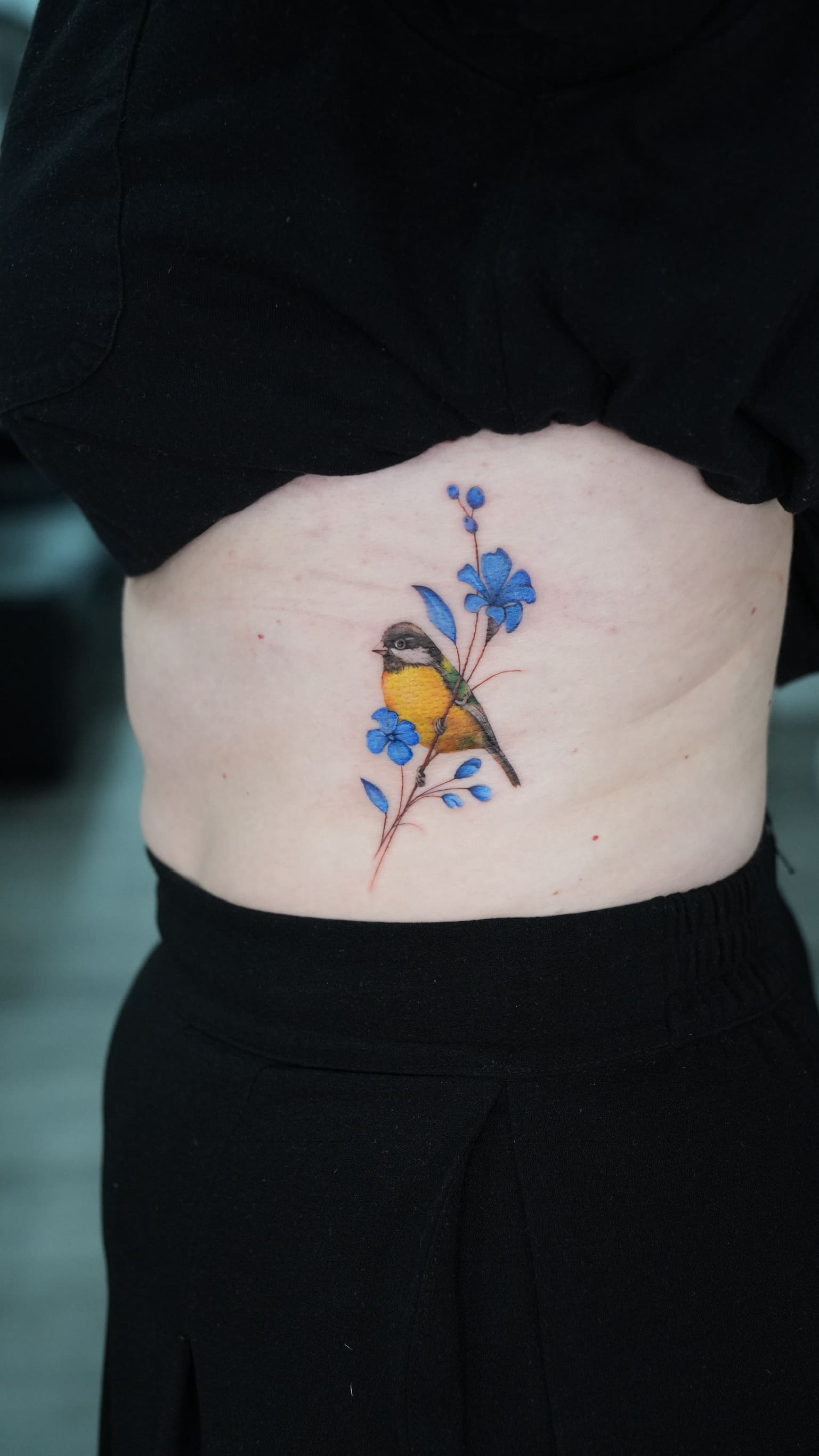 Colorful Songbird & Blue Floral Tattoo