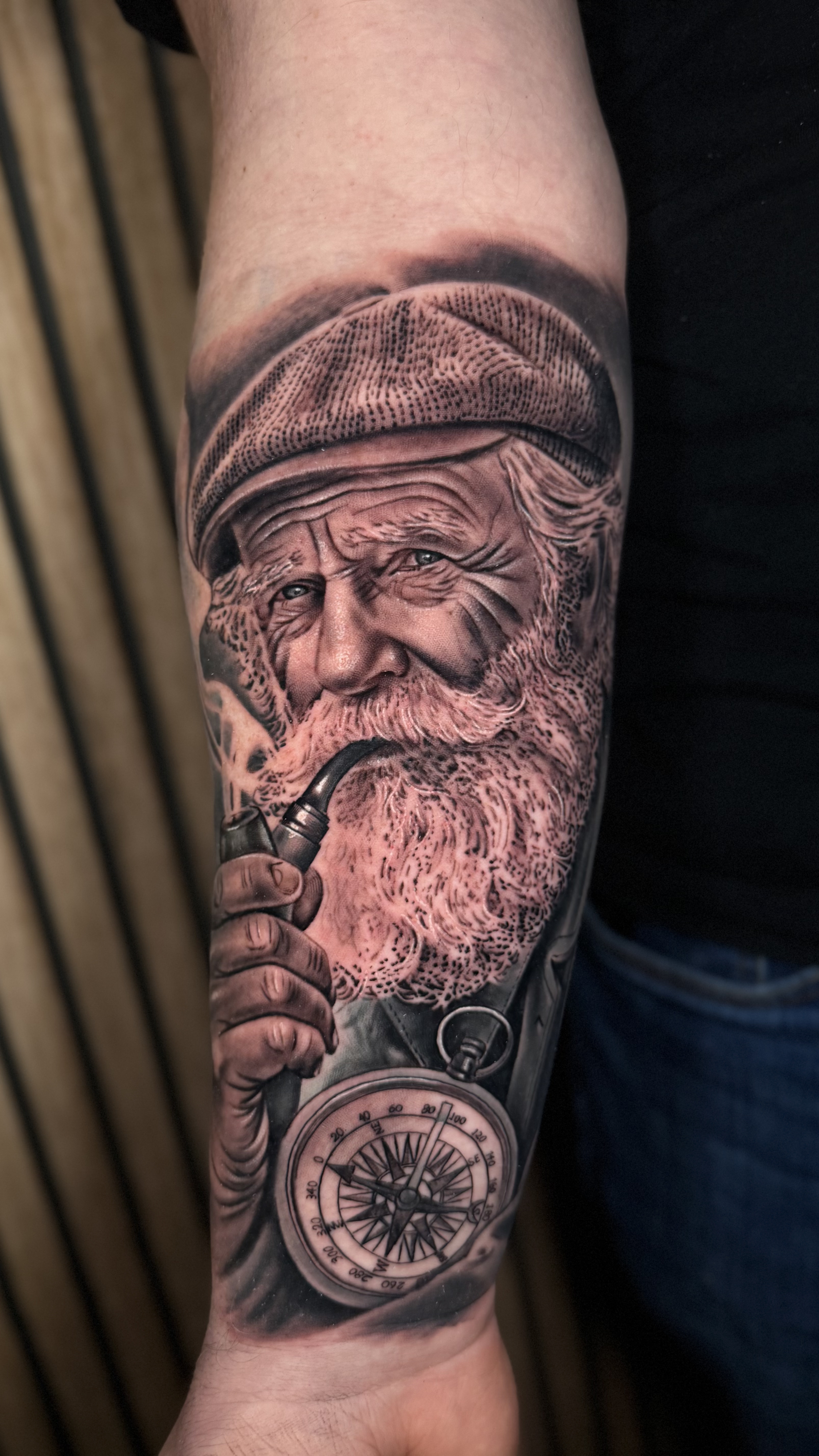 Old Sailor with Pipe and Compass