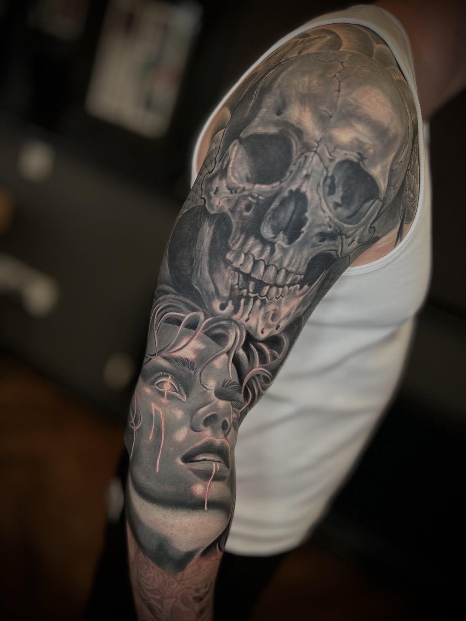Realistic Skull and Surreal Female Portrait Tattoo