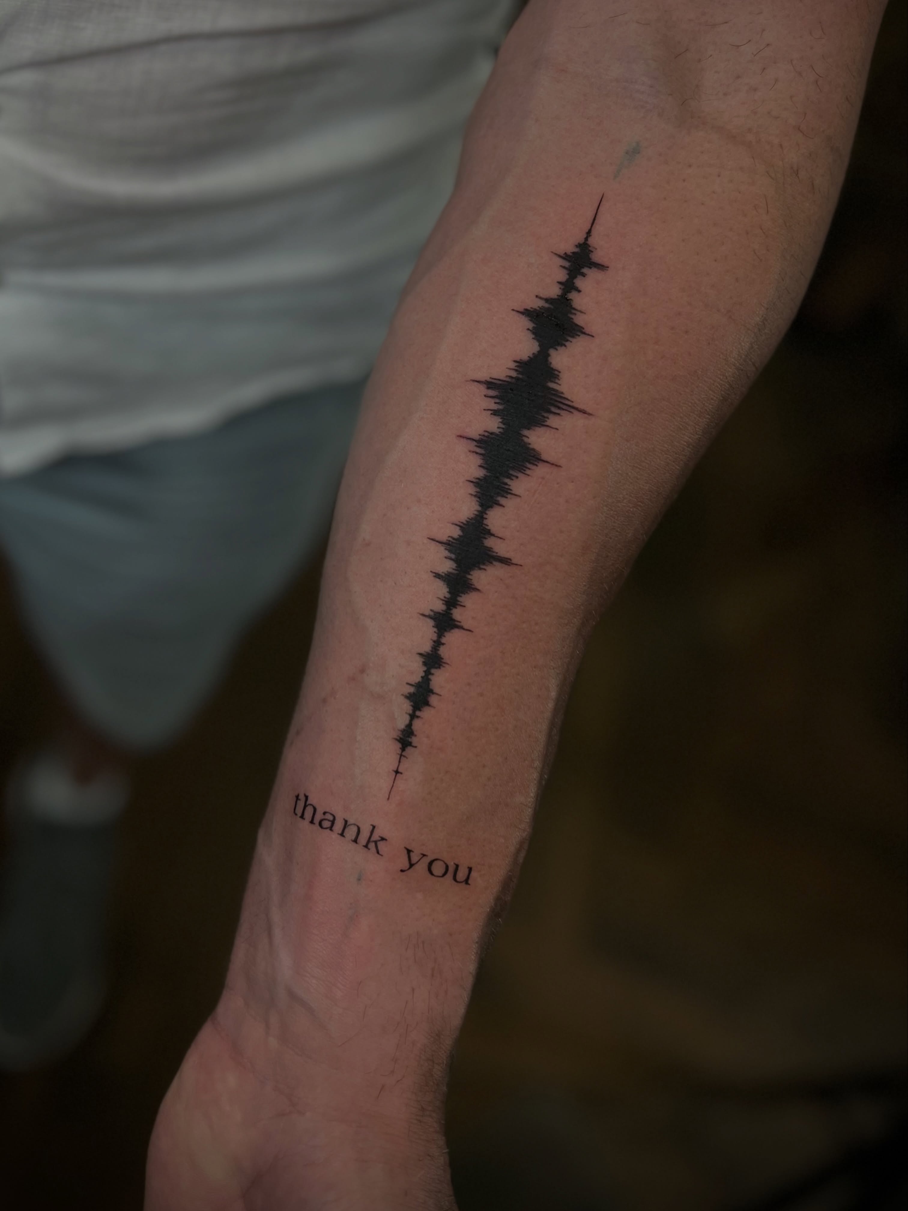 Abstract Blackwork Tattoo with Lightning and “I Believe” Lettering