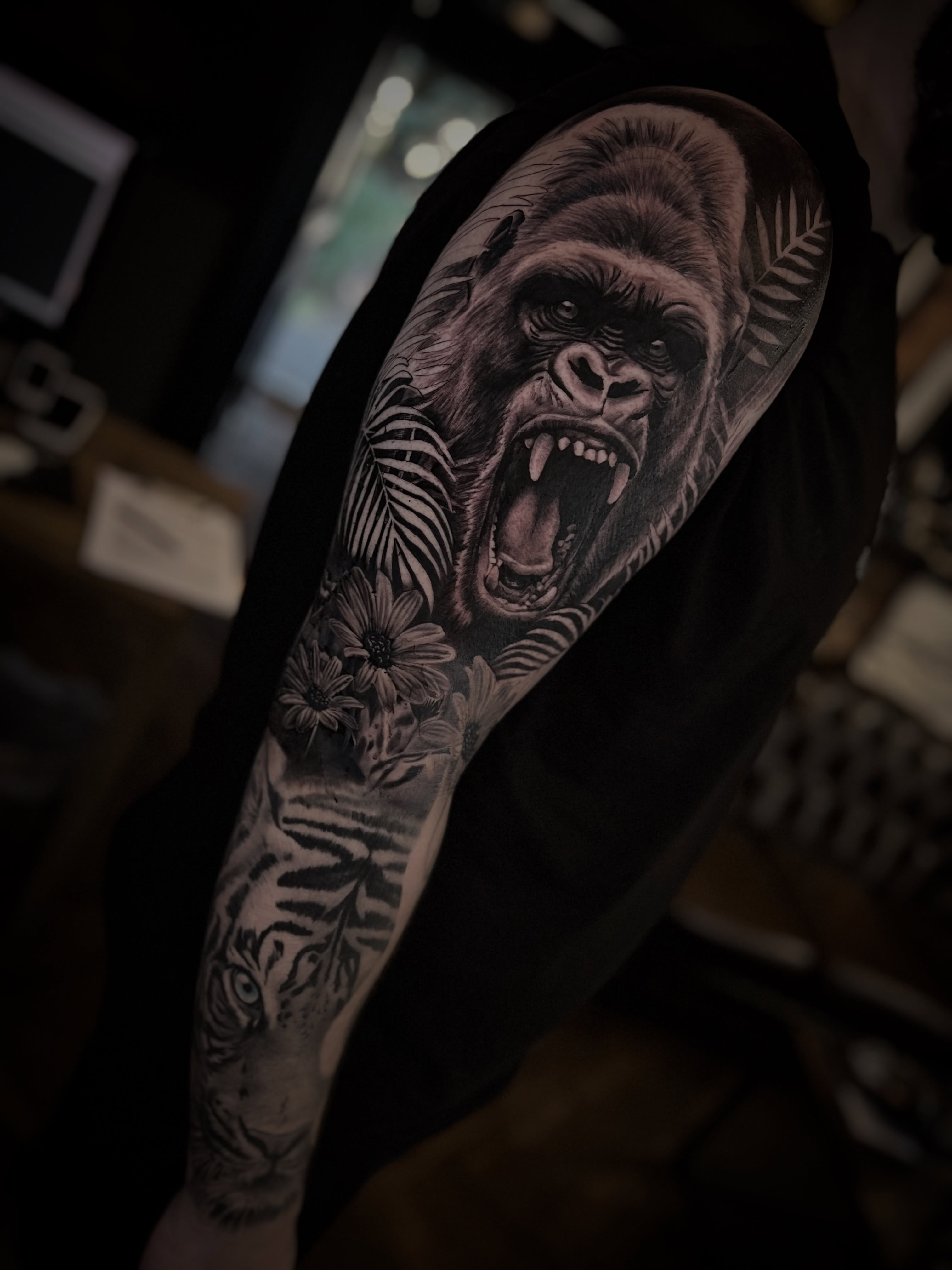 Roaring Gorilla with Tropical Leaves and Flowers Tattoo
